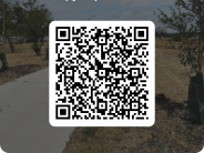 image of large qr code to sign up to volunteer with background of Huebner Creek Greenway Trail