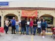 DC Molina Owners, family members, Mayor Riley, City Manager Caldera photo op for ribbon cutting ceremony