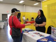 AAMPO representative sharing information at EWL day event booth