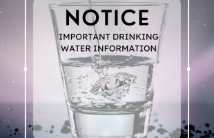 Image of water poured into a clear medium glass sharing a drinking water notice